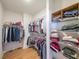 Spacious walk-in closet with ample storage, including hanging rods and shelving units for organized clothing and accessories at 171 Echols Bnd, Hiram, GA 30141