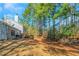 Large backyard surrounded by mature trees, creating a private and serene outdoor space at 3268 Rivermist Cv, Decatur, GA 30034