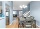 Open concept floor plan showing the dining area, stairs, and living room at 3268 Rivermist Cv, Decatur, GA 30034
