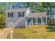 Charming two-story home with a well-manicured lawn and attached one car garage at 3268 Rivermist Cv, Decatur, GA 30034