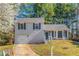 Charming two-story home with a well-manicured lawn and attached one car garage at 3268 Rivermist Cv, Decatur, GA 30034