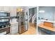 Open kitchen with stainless steel appliances with view into dining room at 3268 Rivermist Cv, Decatur, GA 30034