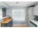 The kitchen offers sleek countertops, stainless appliances and natural light at 3268 Rivermist Cv, Decatur, GA 30034
