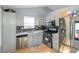 Updated kitchen featuring stainless steel appliances and a stylish backsplash at 3268 Rivermist Cv, Decatur, GA 30034