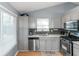 Updated kitchen featuring sleek countertops and modern stainless steel appliances at 3268 Rivermist Cv, Decatur, GA 30034