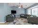 Spacious living room with vaulted ceiling, hardwood floors, large windows, and ample seating area at 3268 Rivermist Cv, Decatur, GA 30034