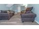 Cozy living room featuring two couches with decorative pillows and new gray wood-look flooring at 3268 Rivermist Cv, Decatur, GA 30034