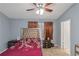 Vaulted main bedroom features a ceiling fan and large windows, providing lots of light at 3268 Rivermist Cv, Decatur, GA 30034