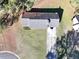 This is an aerial view of the home including the roof, driveway and front yard at 2921 Oakwilde Ct, Snellville, GA 30039