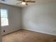 Bedroom with neutral carpet, a window providing natural light, and a ceiling fan at 2921 Oakwilde Ct, Snellville, GA 30039