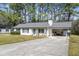 Single-story home with a carport and a driveway, with a partial view of a neighboring house at 2921 Oakwilde Ct, Snellville, GA 30039