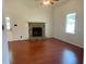 Spacious living room with wood floors, a ceiling fan and a stone fireplace at 2921 Oakwilde Ct, Snellville, GA 30039