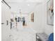 Bright open kitchen with white cabinetry, marble countertops, island and dining area beyond at 1403 Centra Villa Dr, Atlanta, GA 30311