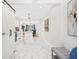 Open kitchen with marble floors, white cabinets, and a view of the dining area at 1403 Centra Villa Dr, Atlanta, GA 30311