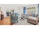 Bright living room with hardwood floors, blue accents, and comfortable seating at 1403 Centra Villa Dr, Atlanta, GA 30311
