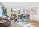 Cozy living room featuring a fireplace, plush seating, and natural light at 1403 Centra Villa Dr, Atlanta, GA 30311
