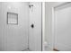 Stylish shower with white herringbone tiles, a modern showerhead, and a built-in niche at 1403 Centra Villa Dr, Atlanta, GA 30311