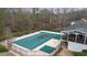 A bird's-eye view of the neighborhood pool showing the sundeck and second-story clubhouse veranda at 310 Mulberry Manor Ct, Johns Creek, GA 30005