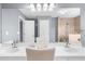 Bright bathroom features a double vanity, tiled shower, and stylish lighting at 310 Mulberry Manor Ct, Johns Creek, GA 30005