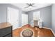 Bedroom with hardwood floors, ample closet space, and bright natural light at 310 Mulberry Manor Ct, Johns Creek, GA 30005