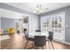Cozy dining area with hardwood floors and adjacent to the living room and deck at 310 Mulberry Manor Ct, Johns Creek, GA 30005