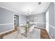 Serene dining room featuring modern decor, white accents, and a contemporary chandelier at 310 Mulberry Manor Ct, Johns Creek, GA 30005