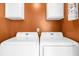 Convenient laundry room featuring a side-by-side washer and dryer at 310 Mulberry Manor Ct, Johns Creek, GA 30005