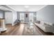 Bright living room with contemporary furnishings, wood floors, and calming gray walls at 310 Mulberry Manor Ct, Johns Creek, GA 30005