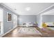 Comfortable living room with stylish decor, hardwood flooring, and soft natural light at 310 Mulberry Manor Ct, Johns Creek, GA 30005