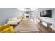 Open-concept living room with fireplace, hardwood floors, and natural light at 310 Mulberry Manor Ct, Johns Creek, GA 30005