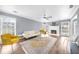 Spacious living room with fireplace, large windows and hardwood flooring at 310 Mulberry Manor Ct, Johns Creek, GA 30005