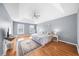 Spacious main bedroom with hardwood floors, ample natural light, and a ceiling fan at 310 Mulberry Manor Ct, Johns Creek, GA 30005