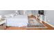 Hardwood flooring and neutral paint can be found in the main bedroom at 310 Mulberry Manor Ct, Johns Creek, GA 30005