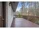 A wooden deck adjoins a brick house at 4551 Cherie Glen Trl, Stone Mountain, GA 30083