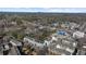 Wide aerial view showing multiple properties, nearby parks, and playgrounds in a well-connected residential neighborhood at 145 Canton St, Alpharetta, GA 30009