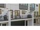 Charming balcony with outdoor seating and a grill overlooking the backyard at 145 Canton St, Alpharetta, GA 30009