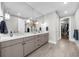 Bright bathroom with a double vanity, modern fixtures, large mirror, and access to the closet at 145 Canton St, Alpharetta, GA 30009