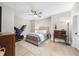 Serene bedroom with neutral tones, a ceiling fan, and hardwood floors at 145 Canton St, Alpharetta, GA 30009