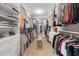 Well-organized walk-in closet with ample shelving, hanging space, and a central bench at 145 Canton St, Alpharetta, GA 30009