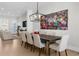 Elegant dining room with a modern chandelier and a colorful floral painting at 145 Canton St, Alpharetta, GA 30009