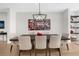 Dining room area is light and airy with a modern chandelier and seating for six at 145 Canton St, Alpharetta, GA 30009