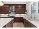 Contemporary kitchen with stainless steel range hood, modern cabinets, and stone countertops at 145 Canton St, Alpharetta, GA 30009