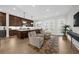 Spacious modern kitchen featuring dark wood cabinets, island with seating, and stainless steel appliances at 145 Canton St, Alpharetta, GA 30009