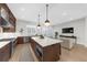 Modern kitchen featuring stainless steel appliances and an open layout to the living area at 145 Canton St, Alpharetta, GA 30009