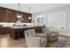 Modern kitchen with island seating, stylish pendant lights, and stainless steel hood at 145 Canton St, Alpharetta, GA 30009