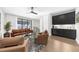 Bright living room with a wet bar, hardwood floors, and comfortable leather seating at 145 Canton St, Alpharetta, GA 30009