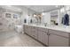 Luxurious main bathroom featuring a double vanity, spa tub, and modern fixtures for a serene experience at 145 Canton St, Alpharetta, GA 30009