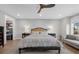 Comfortable main bedroom with neutral decor, featuring a ceiling fan and window with a view to the outside at 145 Canton St, Alpharetta, GA 30009