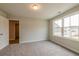 Carpeted bedroom featuring neutral walls and bright natural light at 1730 Fulmont Cir, Mableton, GA 30126