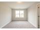 Carpeted bedroom featuring neutral walls and bright natural light at 1730 Fulmont Cir, Mableton, GA 30126